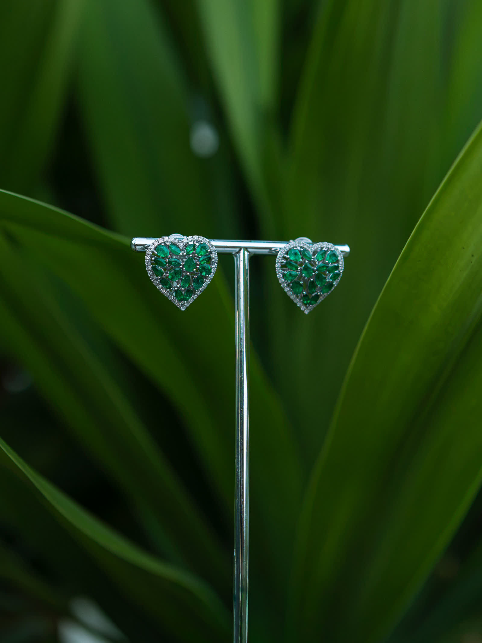 Emerald Heart Earrings — Emerald hearts traced by diamonds.