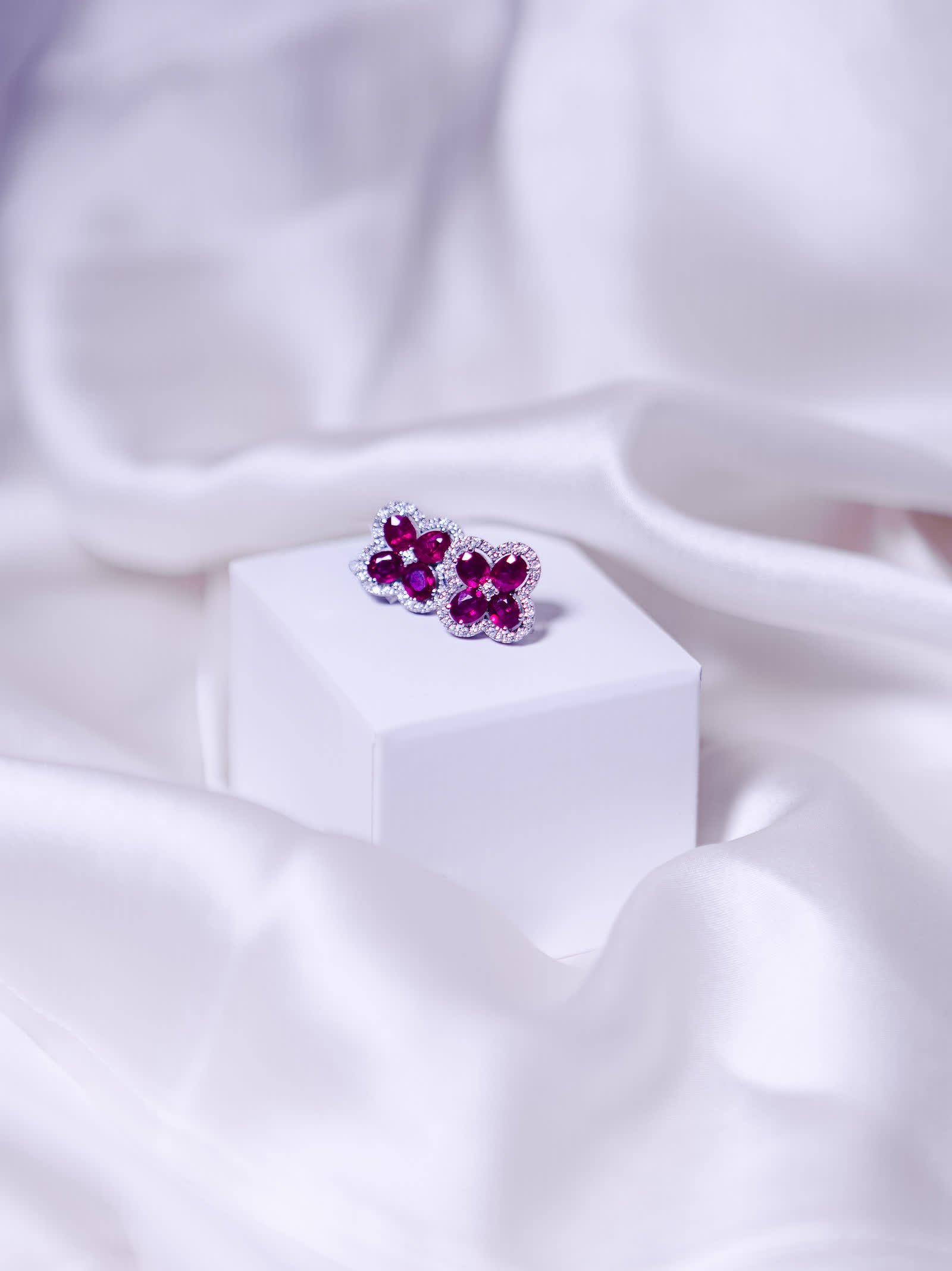 Ruby Clover Earrings — A ruby clover bordered with diamonds.