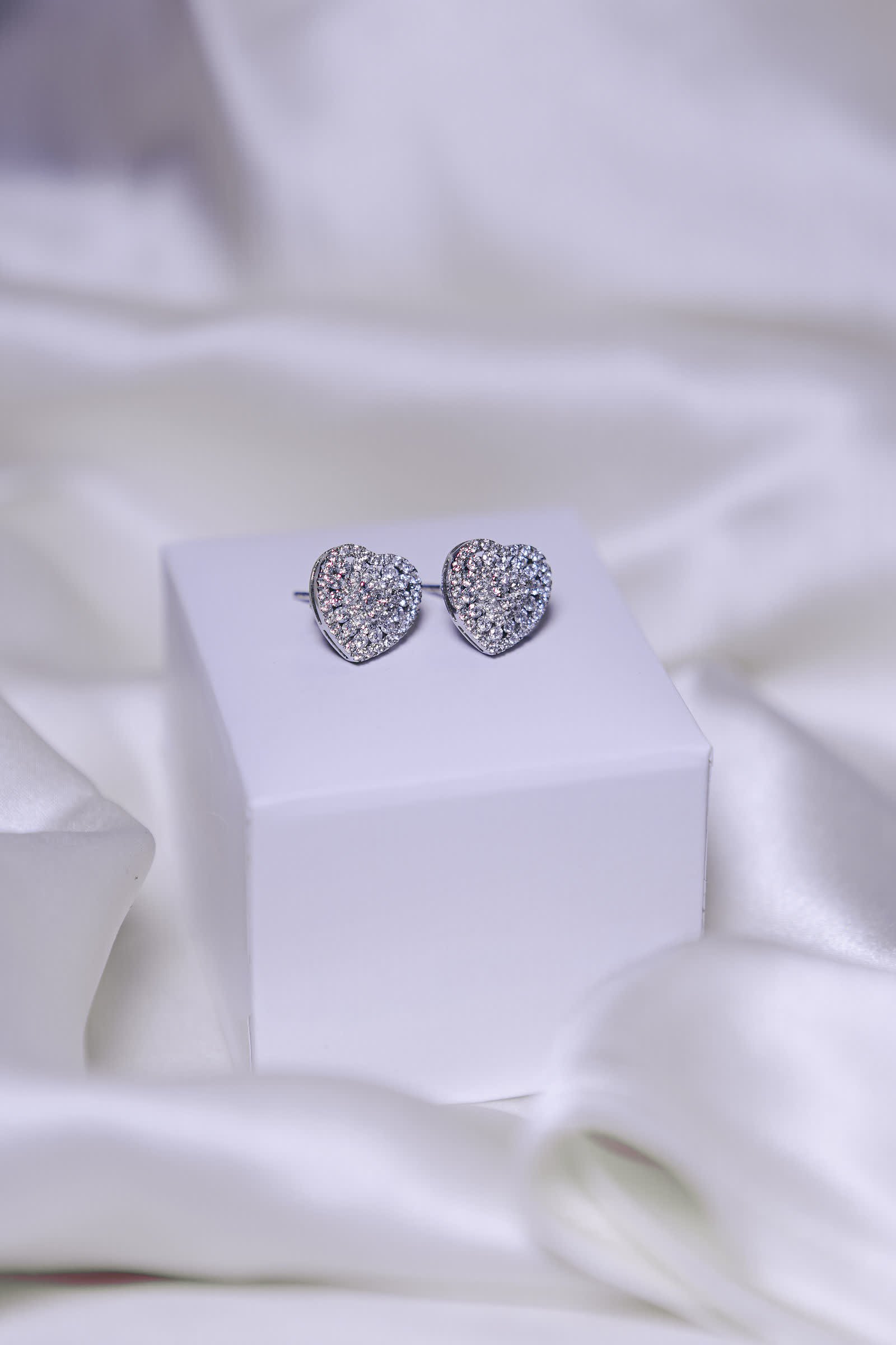 Heart Pavé Earrings — Pavé diamond hearts with a defined border.